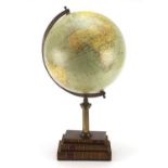 Terrestrial globe raised of a stack of faux books by Greaves & Thomas, 55cm high :For Further