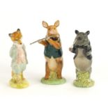 Two Beswick pig band figures and a Beatrix Potter figure, the largest 13cm high :For Further