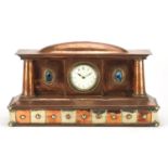 Arts & Crafts copper and brass mantel clock set with two Ruskin type cabochons, the dial with Arabic