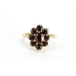 9ct gold garnet flower head ring, size M, 2.8g :For Further Condition Reports Please Visit Our