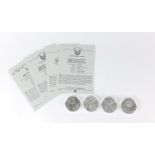 Four United States of America silver eagle dollars with certificates comprising dates 2001, 2002,