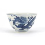 Chinese porcelain tea bowl, finely hand painted with a dragon amongst clouds chasing the flaming