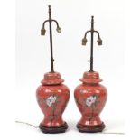 Pair of Chinese porcelain baluster vases and cover table lamps raised on hardwood stands, hand