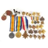 British Military World War I trio with dress medals, dog tags, badges and pips, the trio awarded