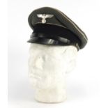 German Military interest visor cap with badges and part label to the interior :For Further Condition