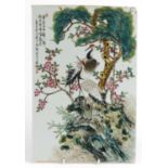Chinese porcelain plaque, hand painted in the famille rose palette with two cranes amongst pine