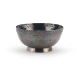 Circular unmarked silver footed bowl, engraved with fruiting vines, 10.5cm in diameter, 121.7g :