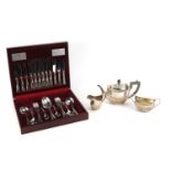 Silver plated three piece tea set and a forty four piece canteen of stainless steel cutlery by