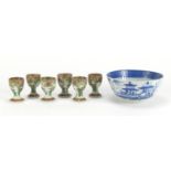 Chinese blue and white porcelain bowl and six Canton egg cups hand painted with flowers, the bowl