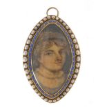 Georgian hand painted portrait miniature of a young male, housed in an unmarked gold mourning brooch