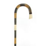 Segmented horn and bone walking stick, possibly rhinoceros horn, 98cm in length :For Further