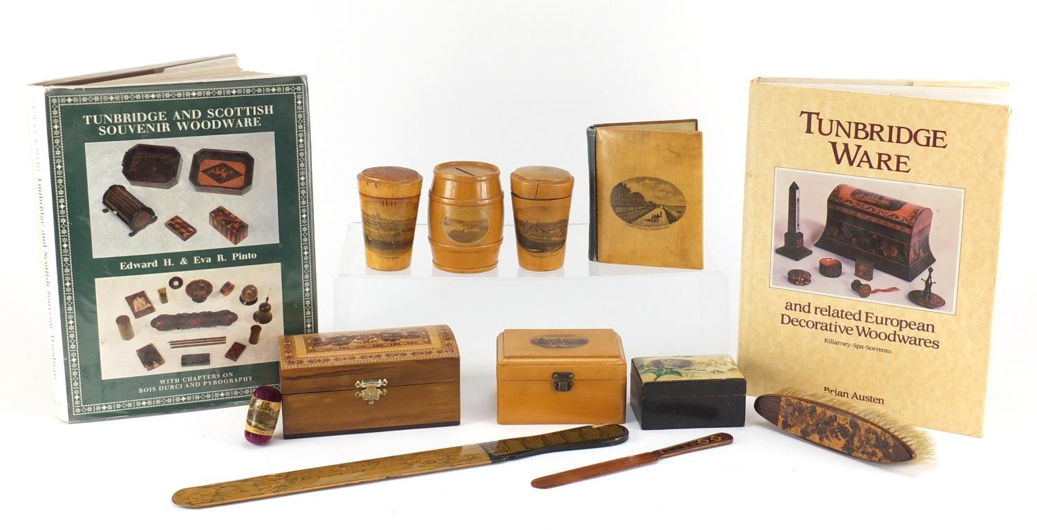 Woodenware and reference books including Mauchline Ware pin cushion, Tunbridge Ware letter opener