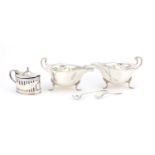 Silver items including a pair of three footed sauce boats by Mappin & Webb and a mustard with blue