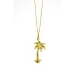 18ct gold palm tree pendant on an 18ct gold necklace, the pendant 3cm in length, 2.7g :For Further