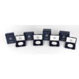 Four American eagle silver proof one ounce bullion coins, with cases and boxes comprising dates