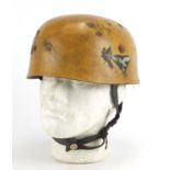 German Military interest tin helmet with decals and leather liner, stamps to the interior :For