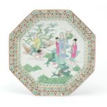 Chinese octagonal porcelain charger hand painted in the famille rose palette with figures riding a