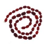 Cherry amber coloured bead necklace, 80cm in length, 77.6g :For Further Condition Reports Please