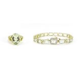 9ct gold green amethyst and diamond bracelet and a 9ct gold green amethyst and peridot ring, size K,