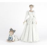 Two Nao figurines including a baby with a spoon and plate, 29cm high :For Further Condition