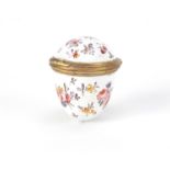 Antique enamel egg design trinket with gilt coloured metal mounts, hand painted with flowers, 4cm