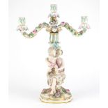19th century German porcelain floral encrusted two branch candelabra , in the form of a mother and