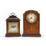 Two mantel clocks comprising an Edwardian inlaid mahogany example and an Elliott clock retailed by