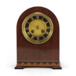 Edwardian inlaid mahogany dome topped mantel clock striking on a gong with French movement, the