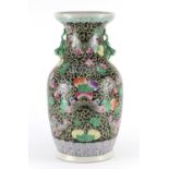 Chinese porcelain vase with twin handles, hand painted in the famille noir palette with