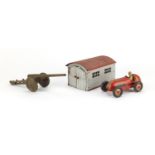 German tin plate garage with clock work racing car and a Marx Toys field gun :For Further