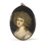 Georgian hand painted portrait miniature of a female, housed in an unmarked gold mourning pendant,