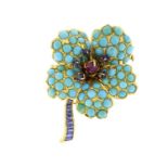 Multi gem flower head brooch set with sapphires, turquoise and a central cabochon ruby, impressed