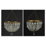 Two brass bag chandeliers with cut glass drops, the largest 25cm high x 20cm in diameter :For