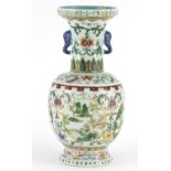 Chinese porcelain vase with elephant head handles, finely hand painted in the famille rose palette