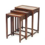 Nest of three Chinese hardwood occasional tables, the largest 65cm H x 51cm W x 32cm D :For