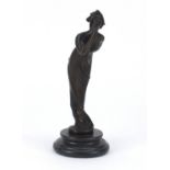 Patinated bronze study of an Art Deco female, raised on a circular marble base, 21cm high :For