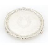 Victorian circular silver three footed salver, by Josiah Williams & Co, with blank cartouche, London