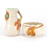 Two Clarice Cliff Newport pottery bowl and vase with naturalistic handle, numbered 907 and 833,