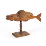 Pitcairn Island carved wood flying fish, dated 1954, one wing impressed made by Fred Christian Great