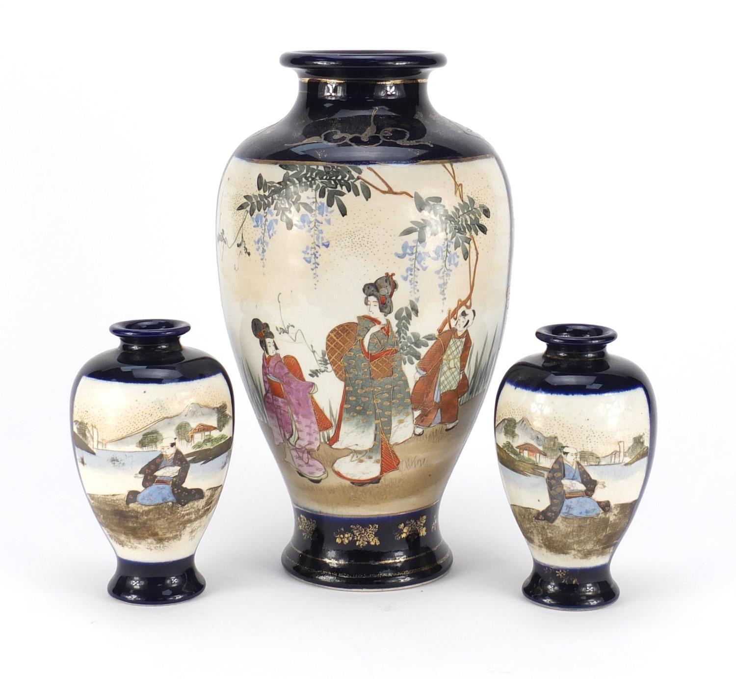 Three Japanese Satsuma pottery vases including a pair, each hand painted with flowers, the largest - Image 2 of 3