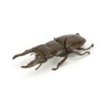 Large Japanese bronze stag beetle with articulated wings, impressed marks to the underside, 13.5cm