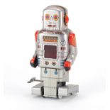 Japanese tin plate clockwork robot by SY, 17.5cm high :For Further Condition Reports Please Visit