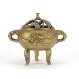 Chinese bronze prunus design tripod censer and cover with twin handles, 18cm high :For Further