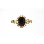 9ct gold garnet brooch, 2.5cm in length, 2.4g :For Further Condition Reports Please Visit Our