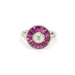 Platinum ruby and diamond halo ring, size N, 4.9g :For Further Condition Reports Please Visit Our