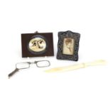 Objects including miniature silver easel frame, ivory cameo carving of stags and a pair of Art