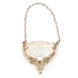 Large silver stags head decanter label with presentation inscription, London 1989, 6cm in length,