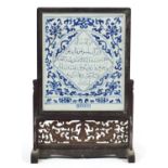 Chinese blue and white porcelain table screen, housed in a carved hardwood stand made for the