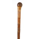 Good Japanese bamboo walking stick, finely carved with a peacock amongst flowers, signed with