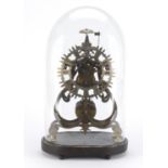 Gothic style brass skeleton clock with fusee movement, under glass dome on an ebonised stand,